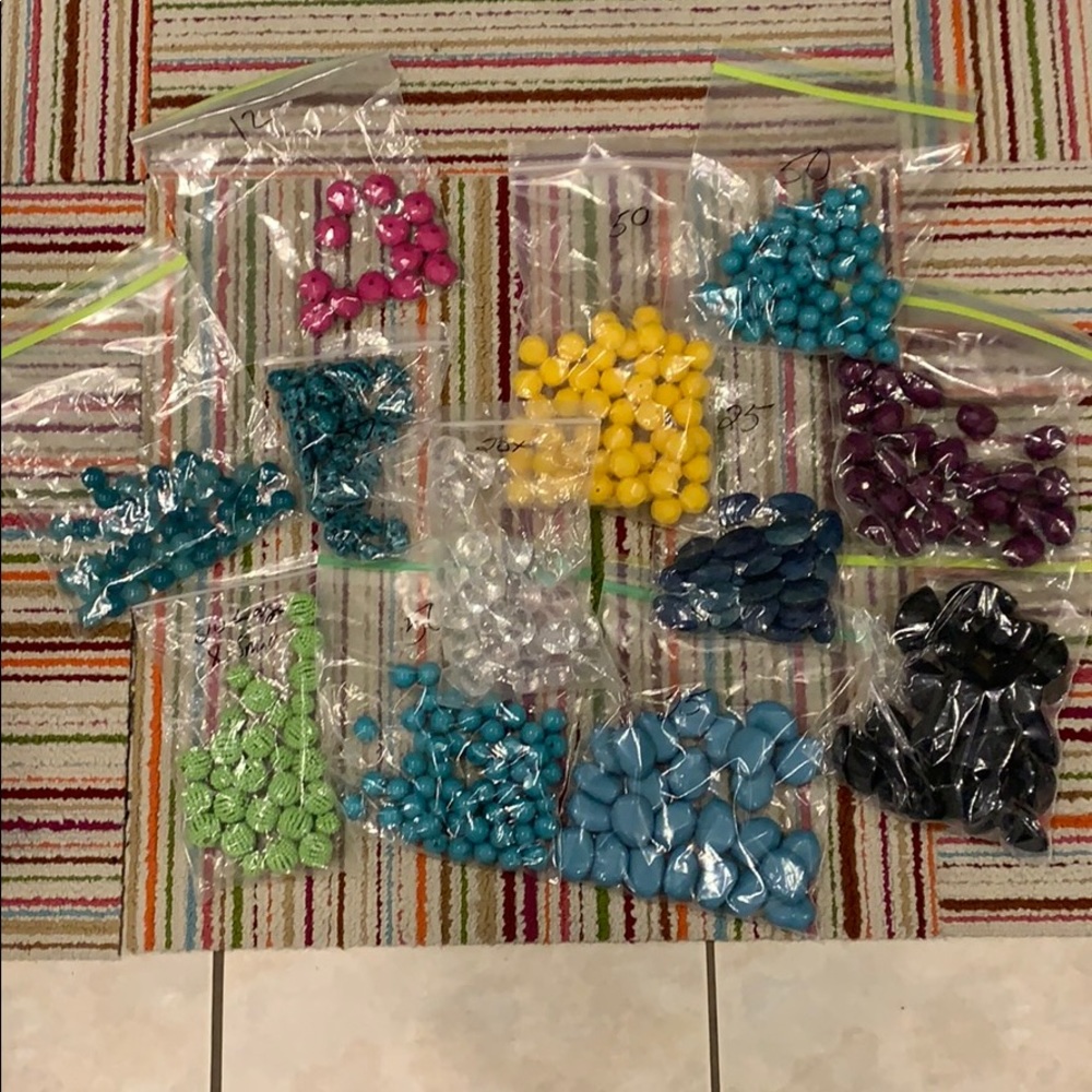 12 bags of loose beads. Different colors and sizes